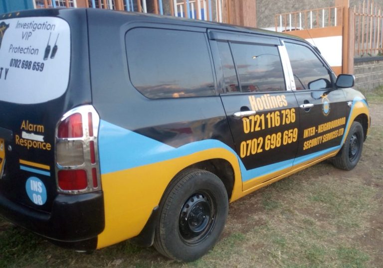 INS patrol van with hotline numbers